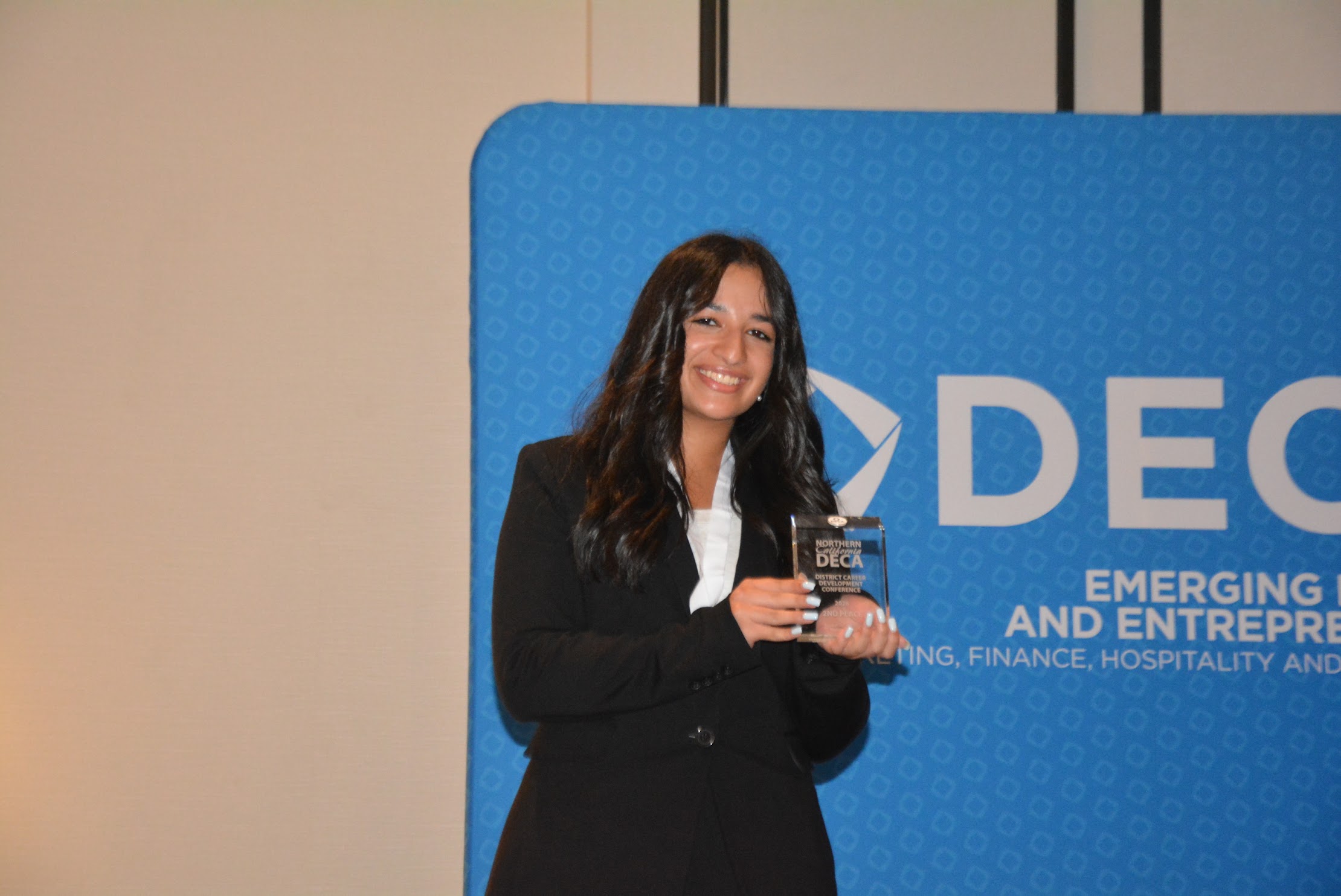 DECA member with medal